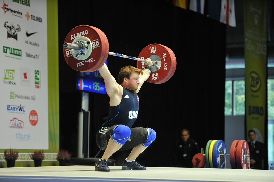 Jack Oliver receiving the snatch in a deep overhead squat